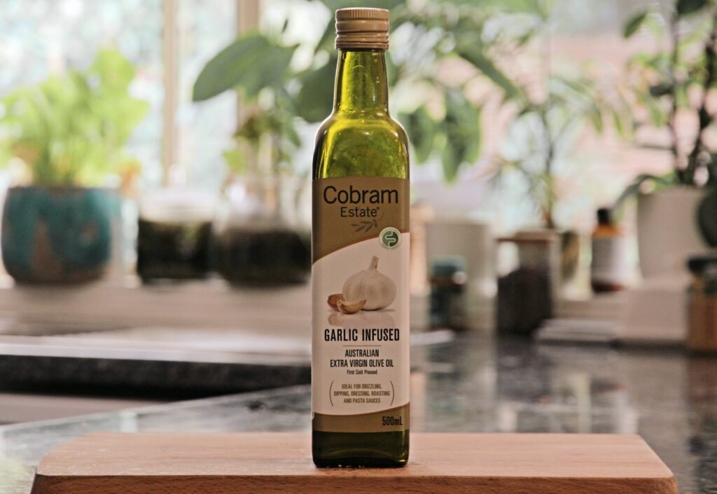 a bottle of garlic oil sitting on top of a counter